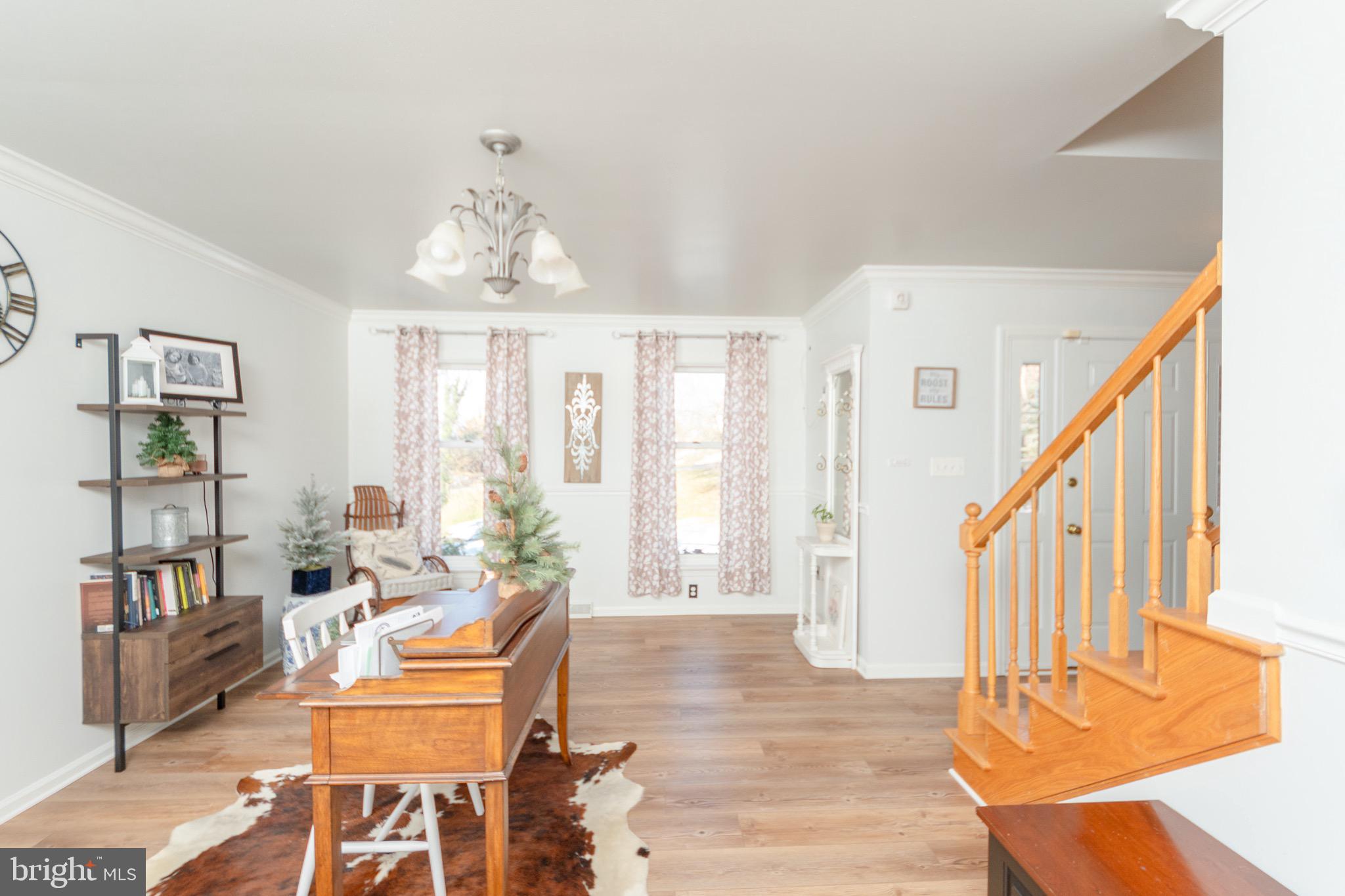 1553 White Oak Road Strasburg, PA 17579 - Photo 10 of 52 a dining room with wooden floor windows and wooden floor