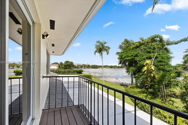 a view of balcony with wooden floor