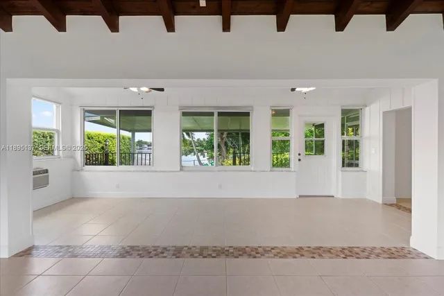 a view of an empty room with windows