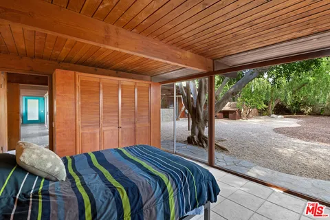 a room with furniture and garden view