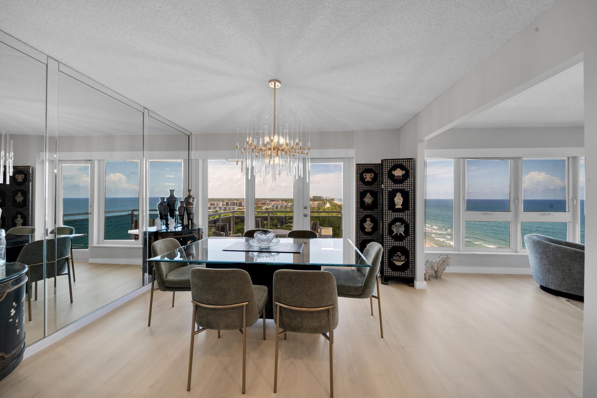 2066 North Ocean Boulevard, Unit 12NE Boca Raton, FL 33431 - Photo 2 of 53 a view of a dining room with furniture window and outside view