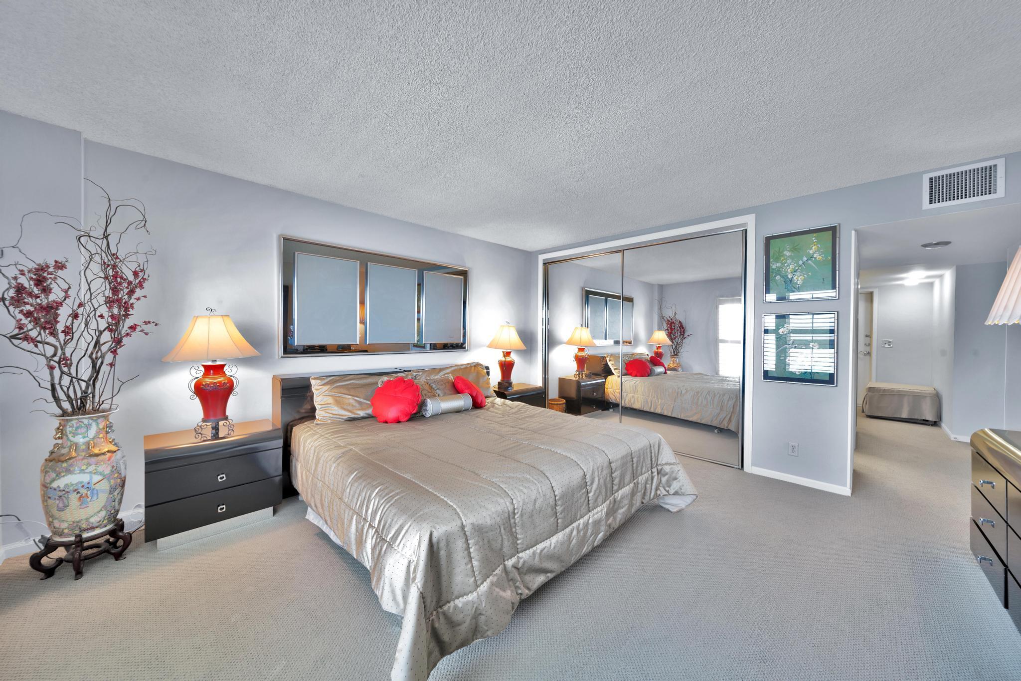 2066 North Ocean Boulevard, Unit 12NE Boca Raton, FL 33431 - Photo 28 of 53 a bedroom with bed and window