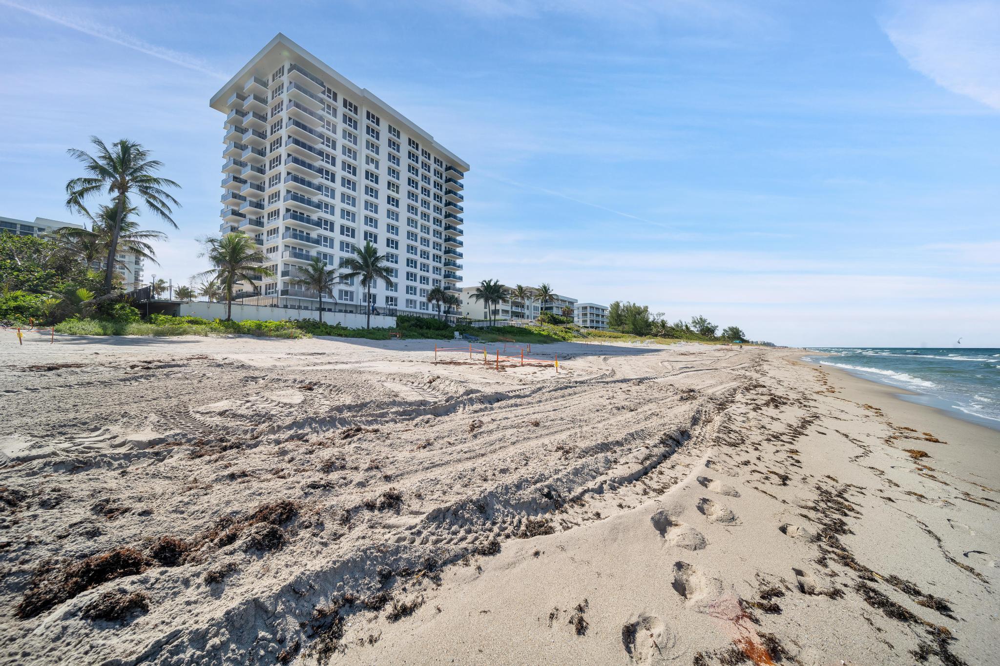2066 North Ocean Boulevard, Unit 12NE Boca Raton, FL 33431 - Photo 36 of 53 a view of a large building with a yard