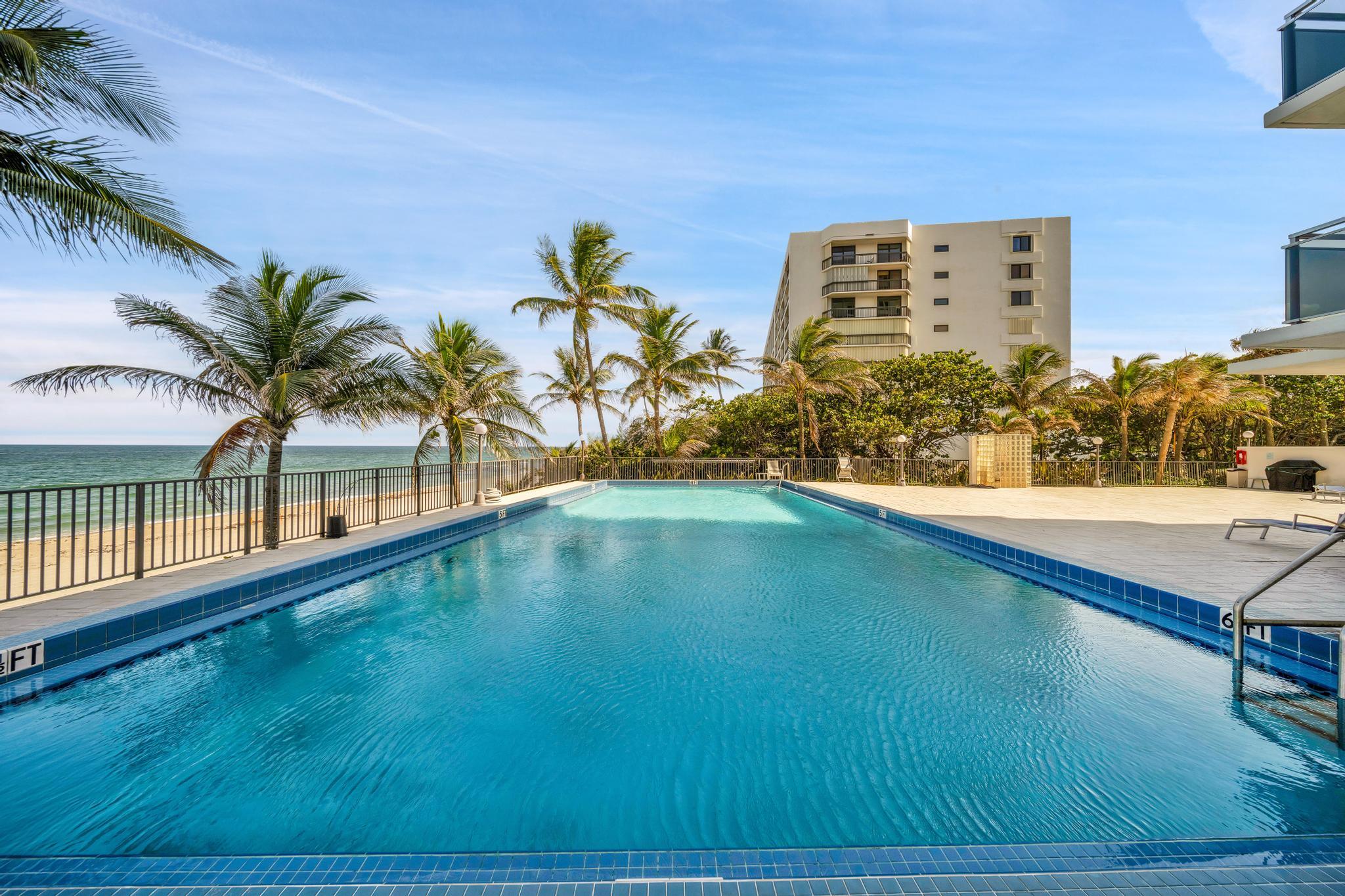 2066 North Ocean Boulevard, Unit 12NE Boca Raton, FL 33431 - Photo 39 of 53 a view of swimming pool with a yard