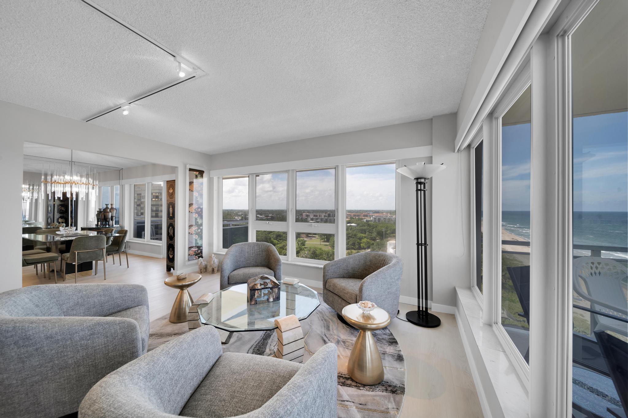 2066 North Ocean Boulevard, Unit 12NE Boca Raton, FL 33431 - Photo 10 of 53 a living room with furniture and a floor to ceiling window