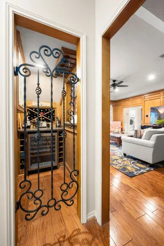 a view of a walk in closet and living room