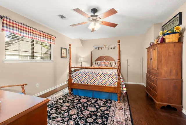 a bathroom with a granite countertop sink vanity and mirror
