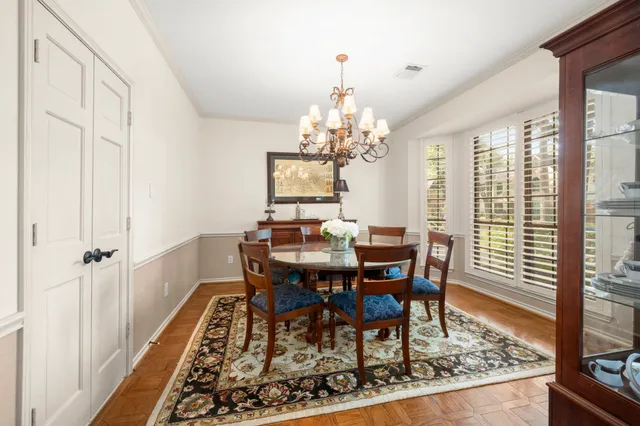 a view of a dining room with furniture and window