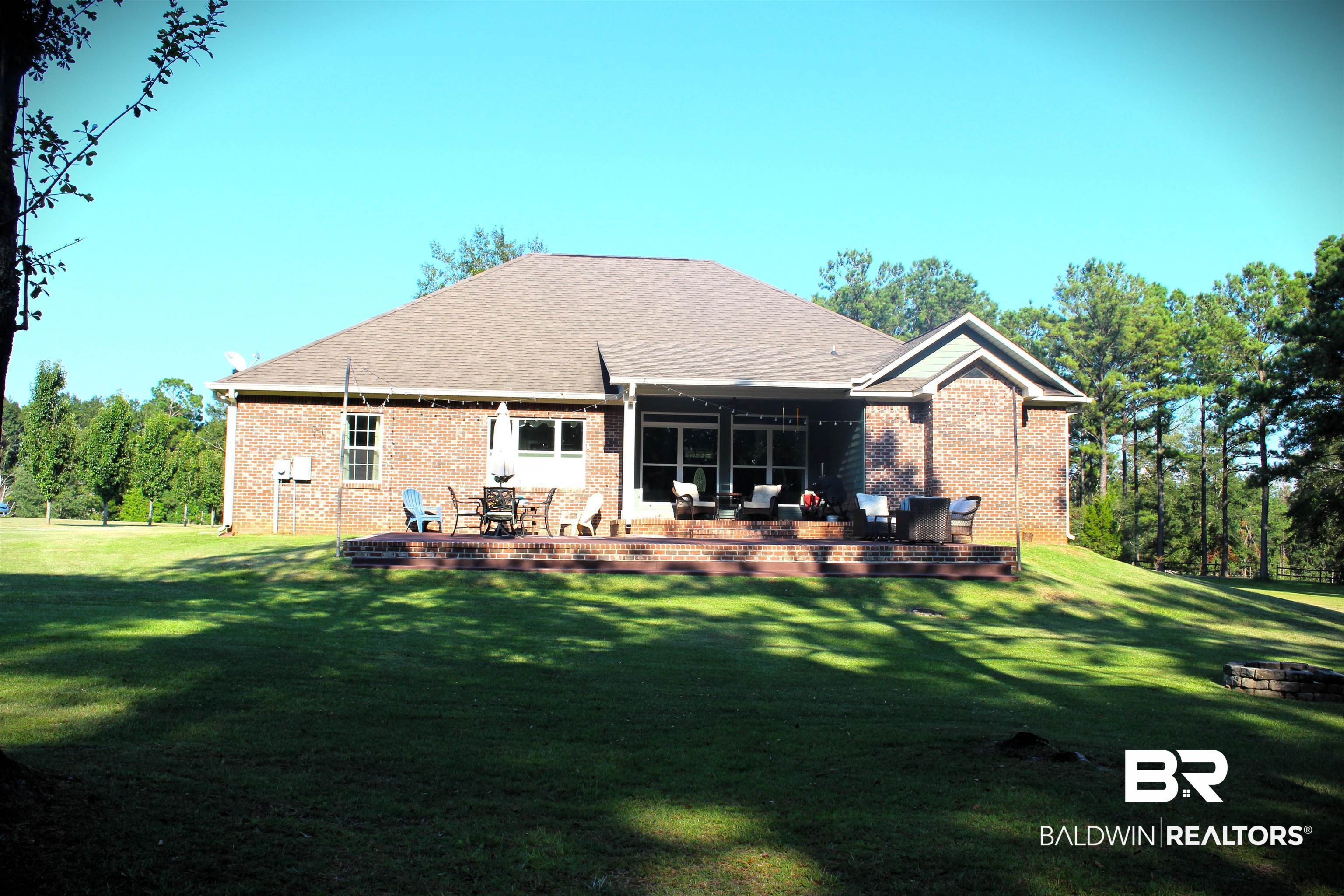 41416 Davis Duck Road Bay Minette, AL 36507 - Photo 13 of 72 Rear view of property with a patio area and a lawn