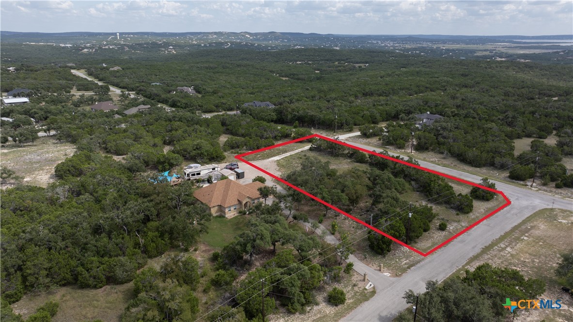 865 Rutherford Fischer, TX 78623 - Photo 20 of 20 an aerial view of a red and white house