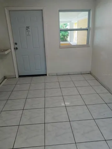 a view of a hallway with a door