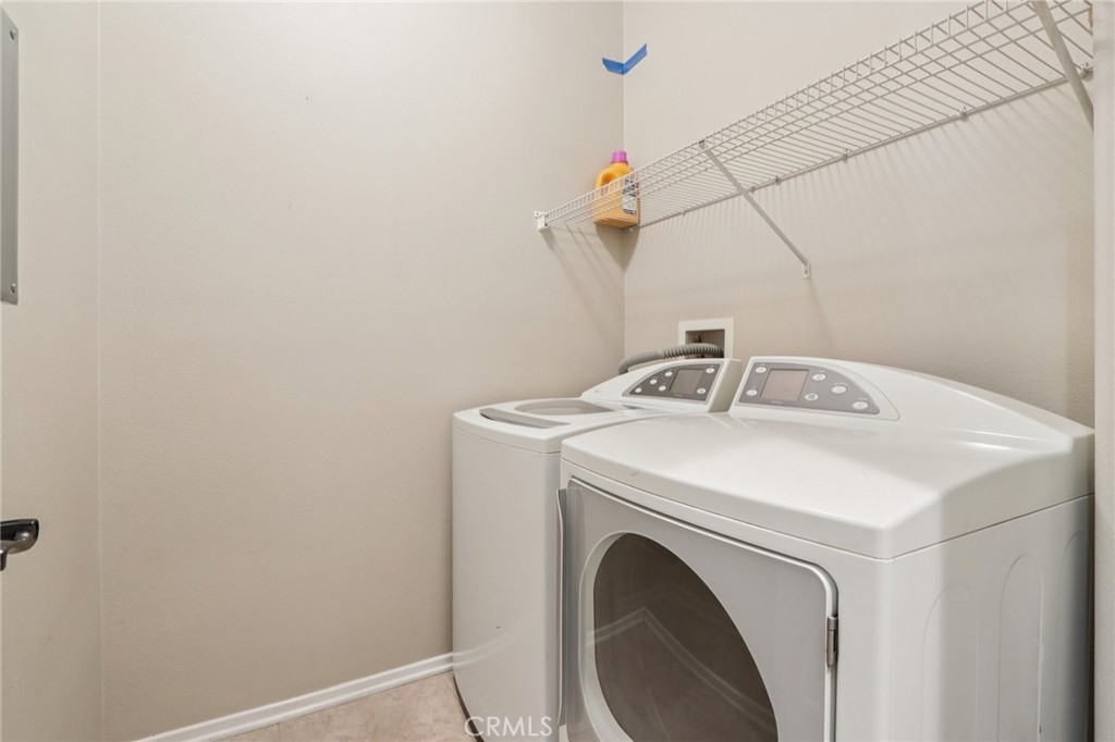 3374 Wind Chime Lane Perris, CA 92571 - Photo 12 of 30 a utility room with dryer and washer