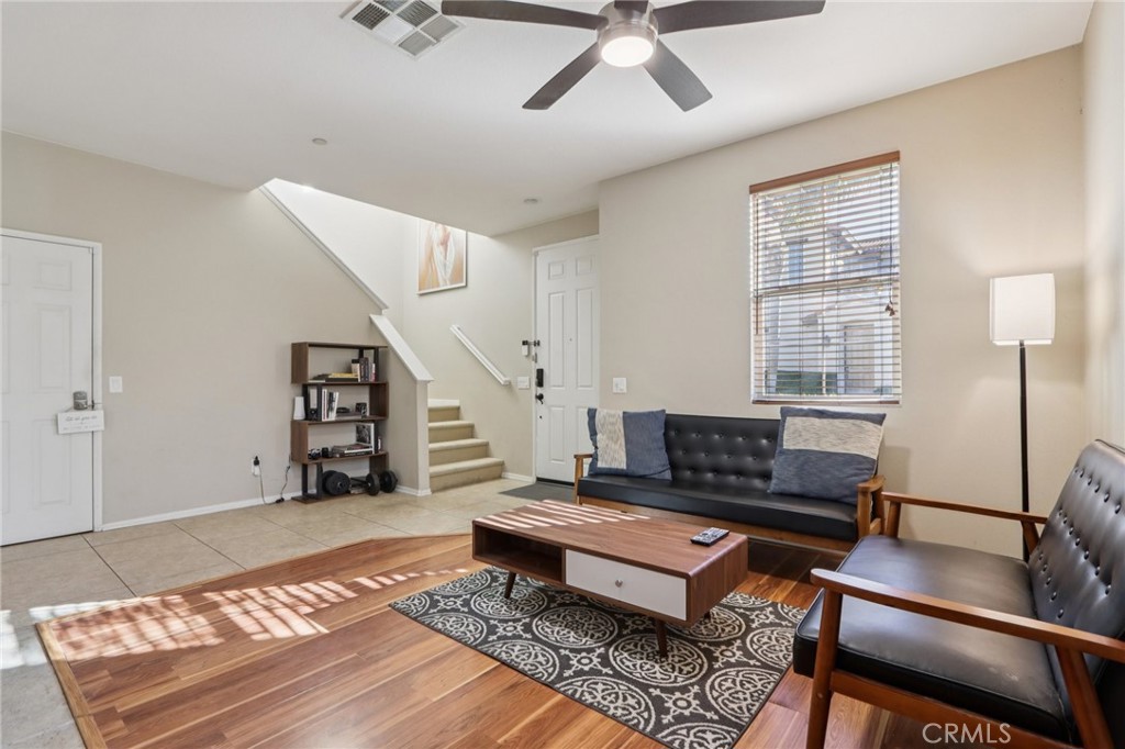 3374 Wind Chime Lane Perris, CA 92571 - Photo 5 of 30 a living room with furniture and wooden floor