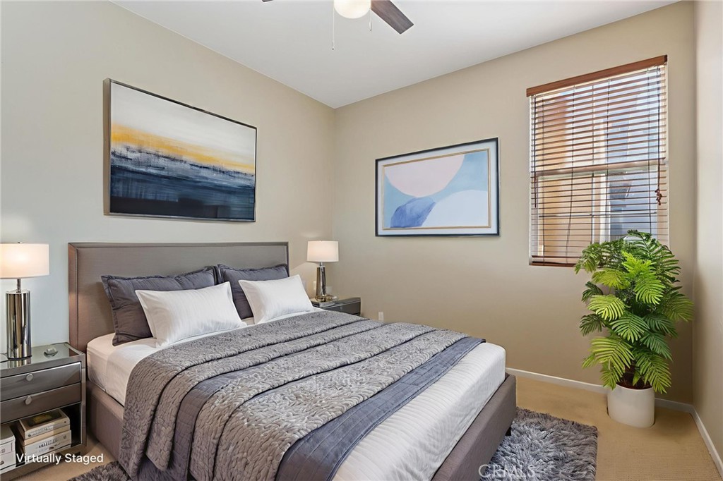 3374 Wind Chime Lane Perris, CA 92571 - Photo 10 of 30 a bedroom with bed and a painting on the wall