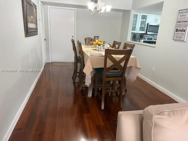 a view of a room with furniture and a window