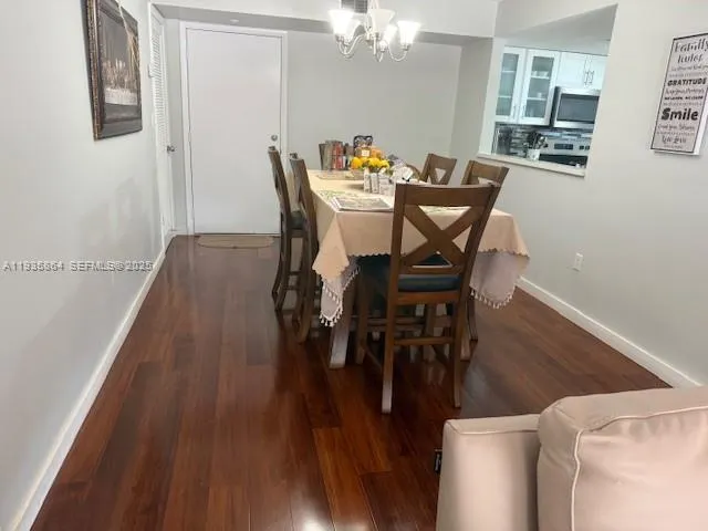 a view of a room with furniture and a window