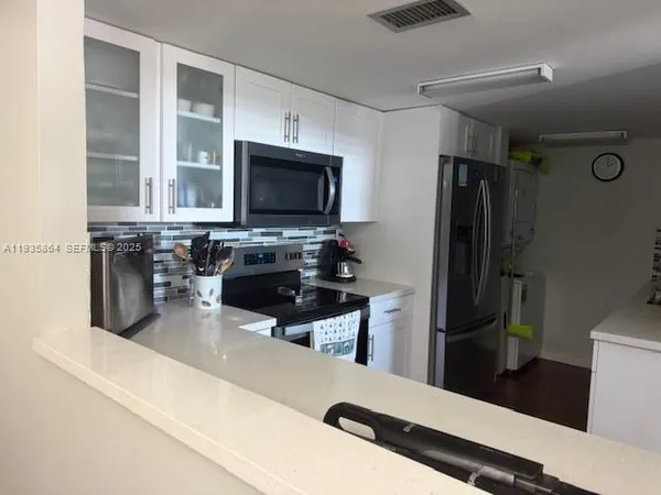 a bathroom with a sink toilet and mirror