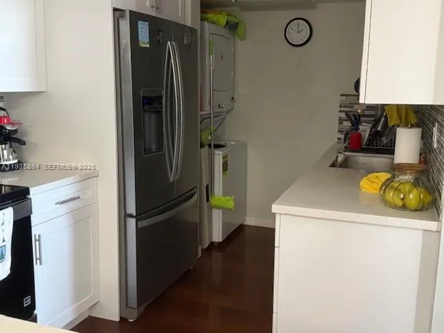a white toilet sitting next to a shower curtain