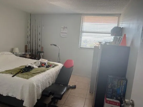 a room with a wooden floor and a window
