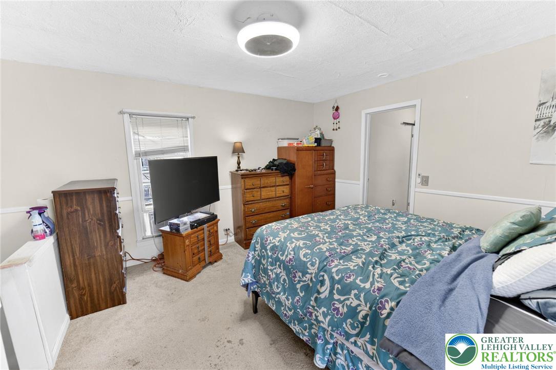 321 Market Street Bangor, PA 18013 - Photo 21 of 33 a bedroom with a bed and wooden floor