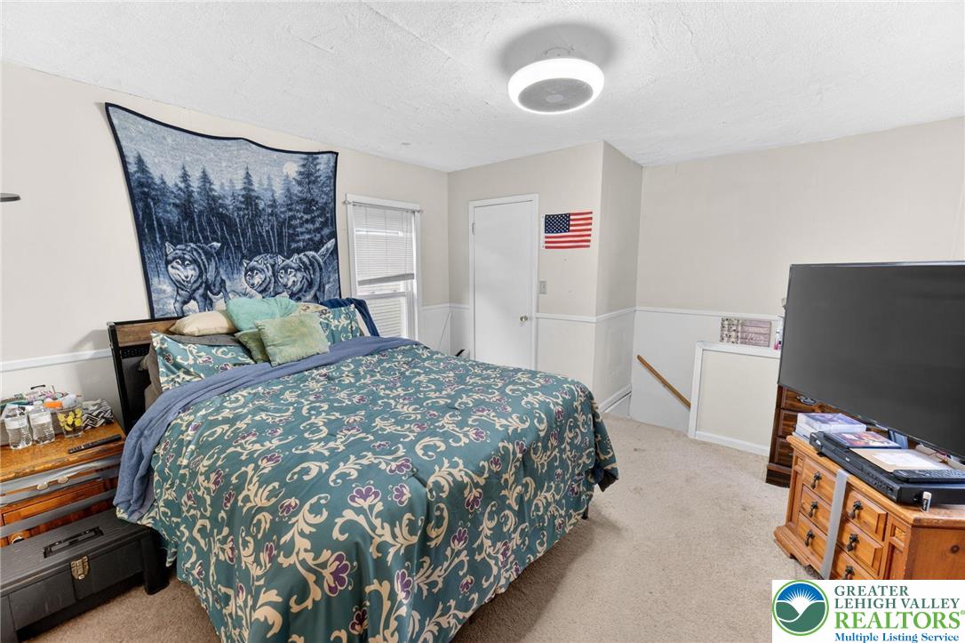 321 Market Street Bangor, PA 18013 - Photo 22 of 33 a bedroom with a bed and a flat screen tv