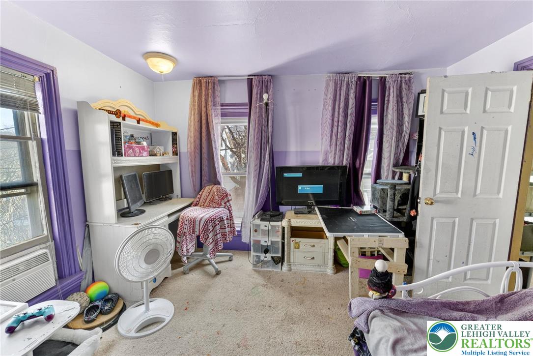 321 Market Street Bangor, PA 18013 - Photo 23 of 33 a bedroom with furniture and a fireplace