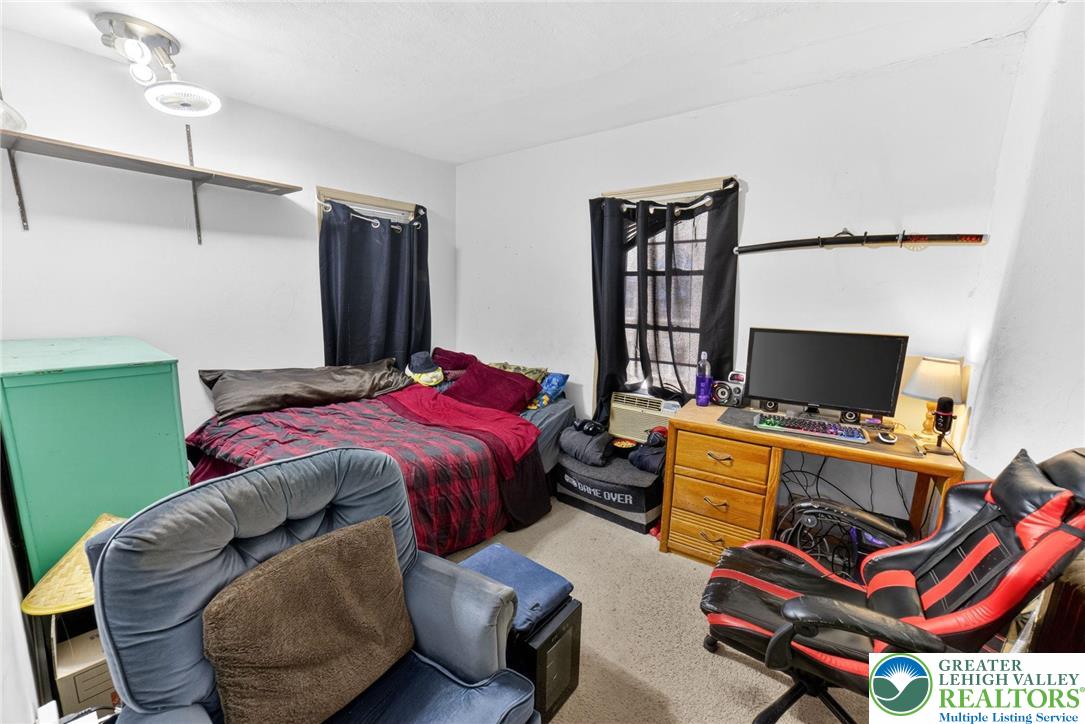321 Market Street Bangor, PA 18013 - Photo 25 of 33 a bedroom with a bed and a flat screen tv