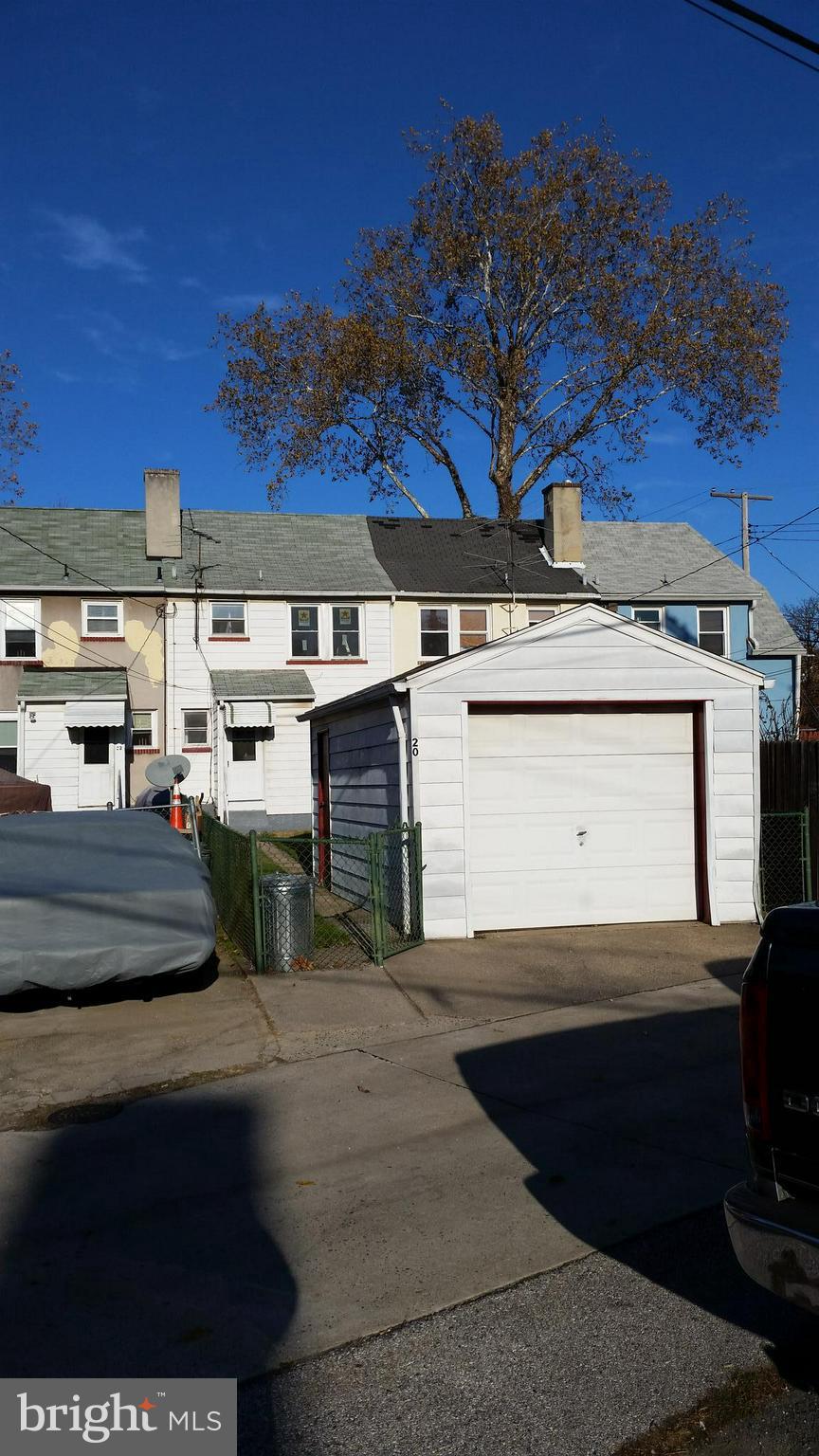 20 Portship Road Baltimore, MD 21222 - Photo 2 of 2 a view of a patio with table and chairs with wooden fence