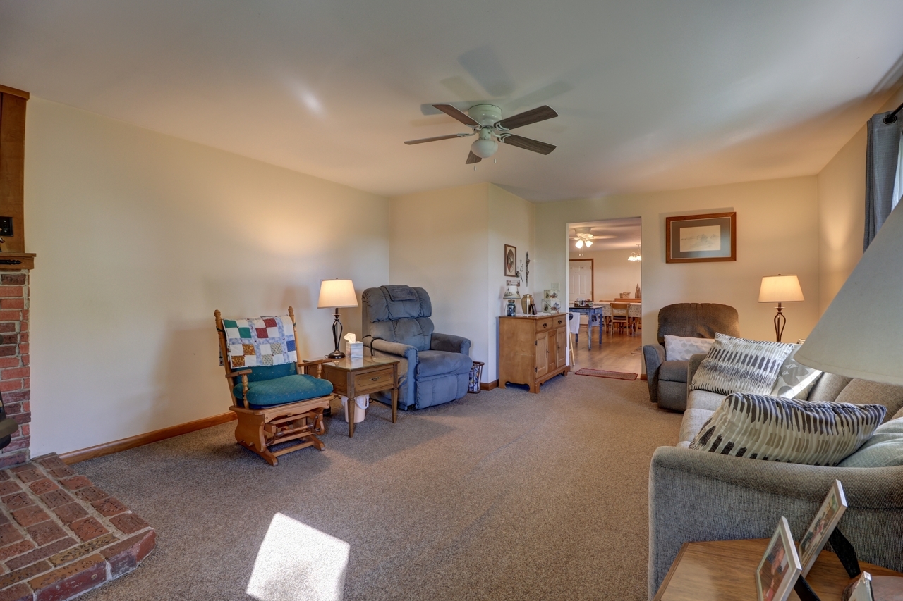 14755 Fenton Road Morrison, IL 61270 - Photo 9 of 34 a living room with furniture and a lamp
