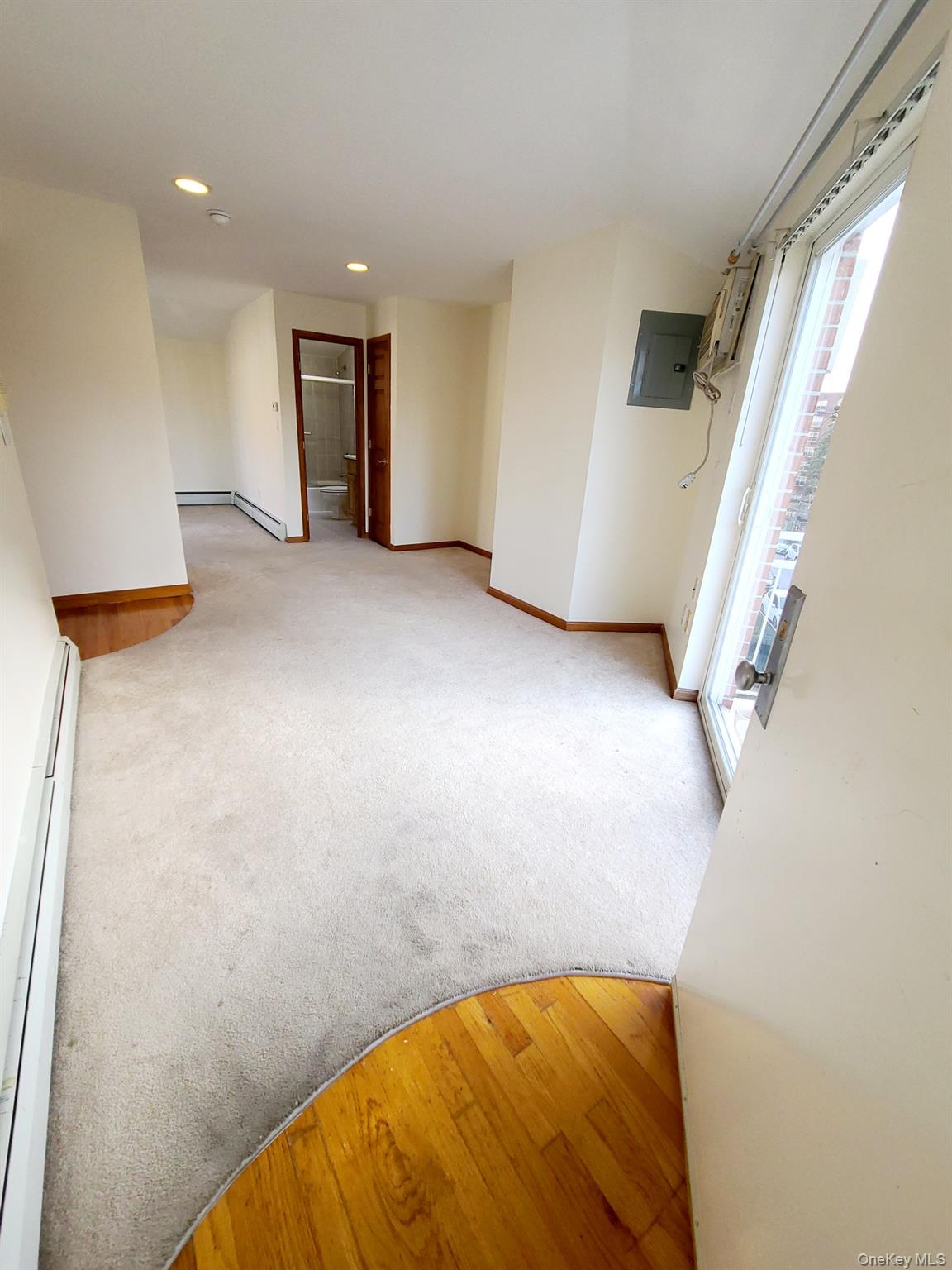 67-08 Exeter Street, Unit 3 Queens, NY 11375 - Photo 12 of 18 a view of an empty room with a window