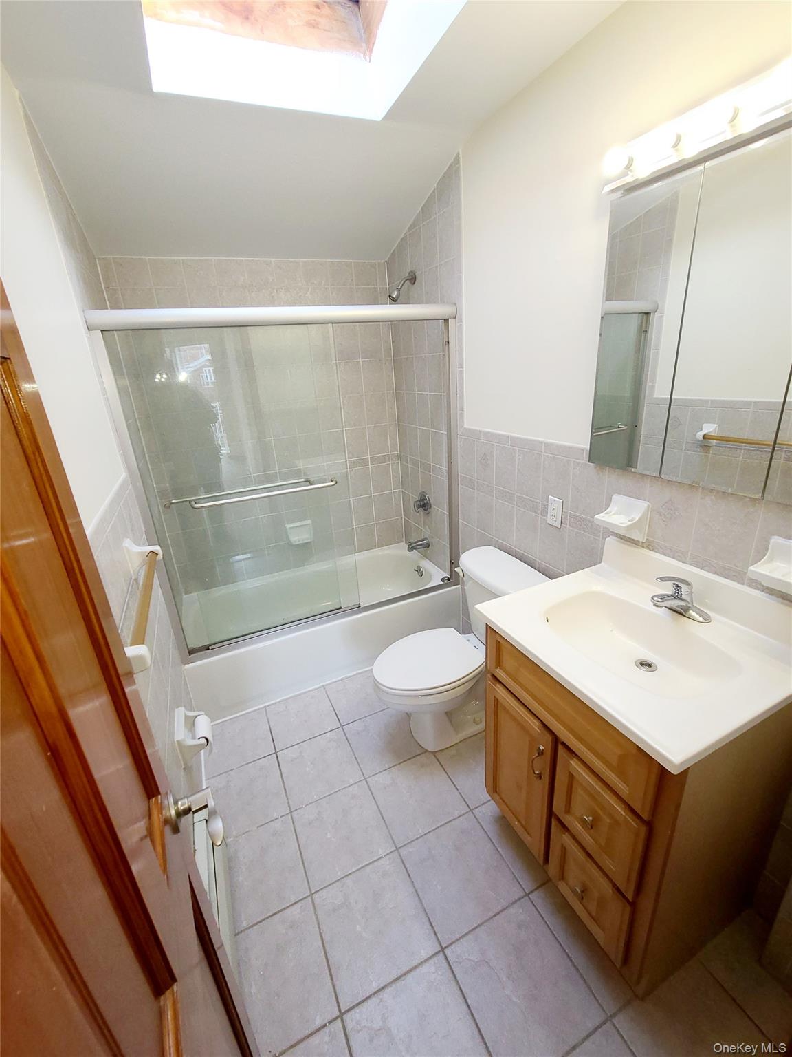 67-08 Exeter Street, Unit 3 Queens, NY 11375 - Photo 15 of 18 a bathroom with a sink a toilet and shower
