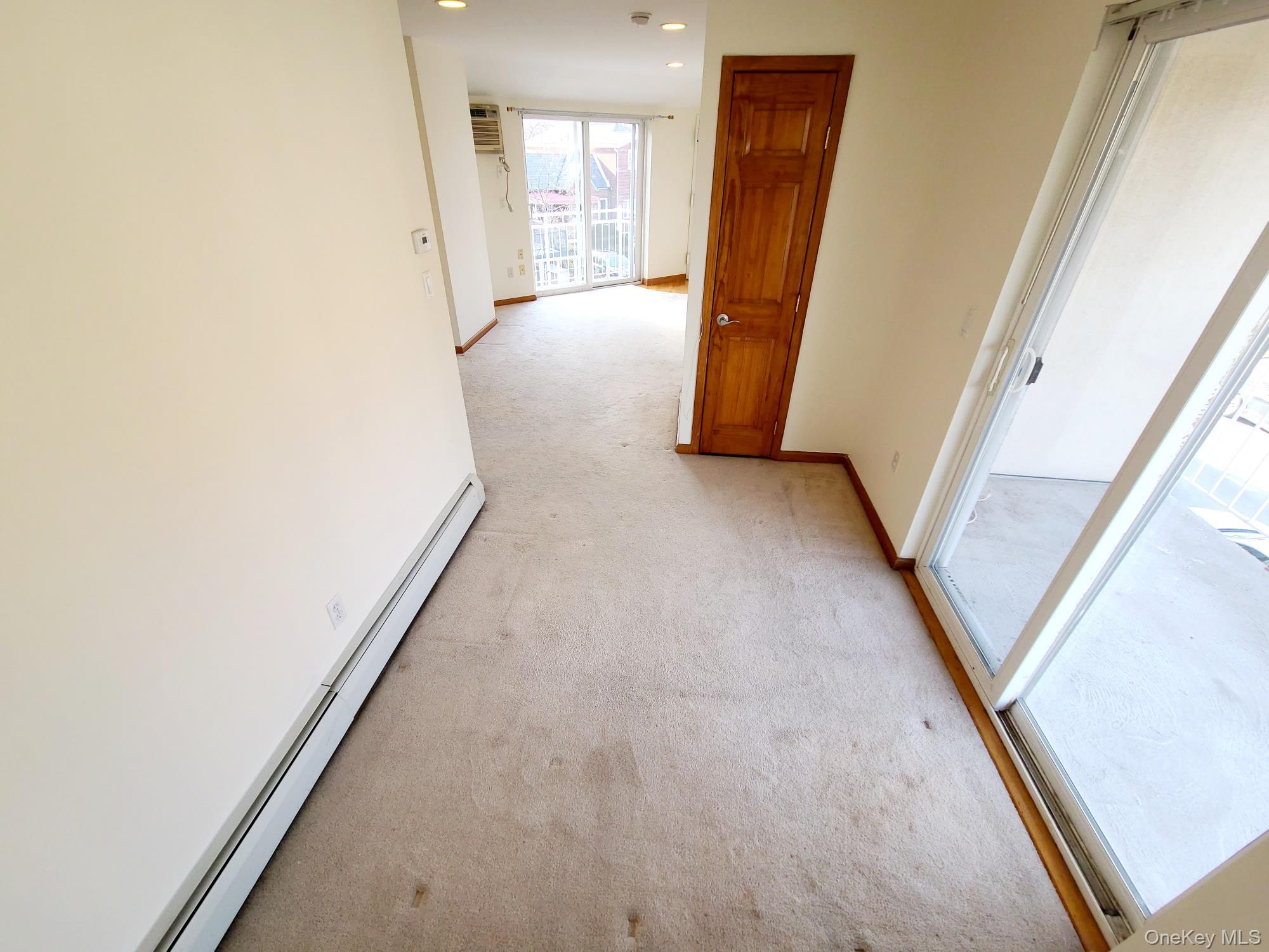 67-08 Exeter Street, Unit 3 Queens, NY 11375 - Photo 10 of 18 an entryway of a house with wooden floor