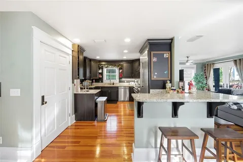 a kitchen with lots of counter top space and refrigerator