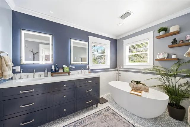 a bathroom with a sink double vanity and a mirror