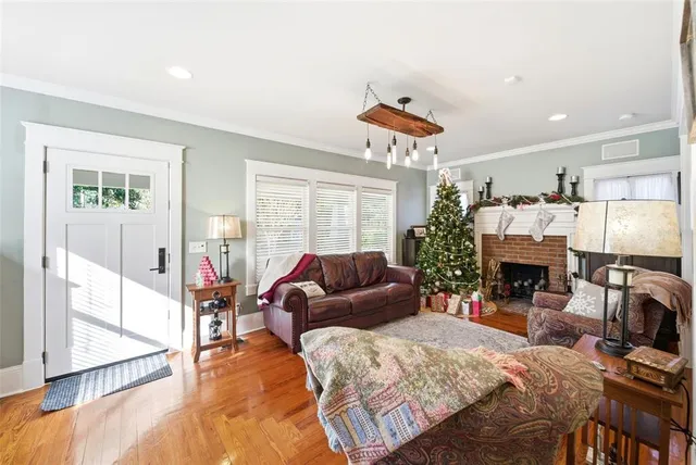 a view of a dining room with furniture window and wooden floor