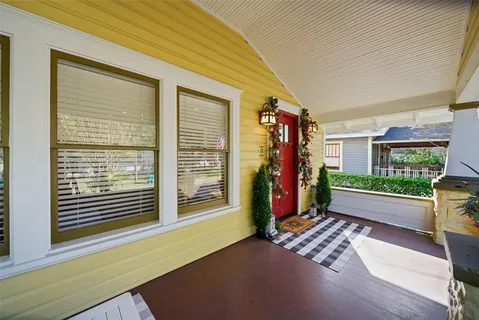 a living room filled with furniture window and a wooden floor