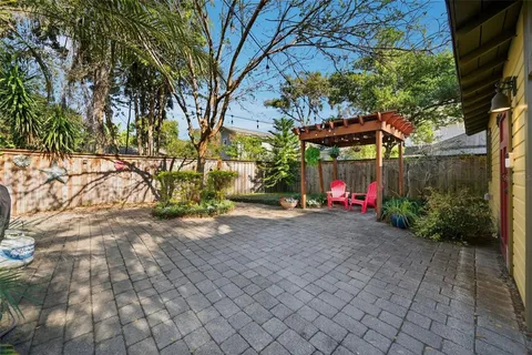 a view of a house with a small yard and plants