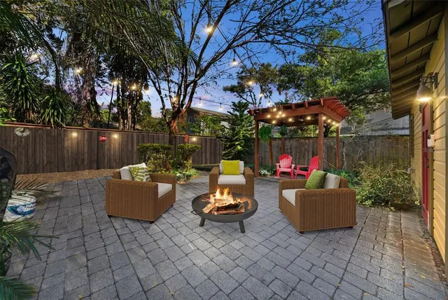 a outdoor living space with patio furniture and a potted plant