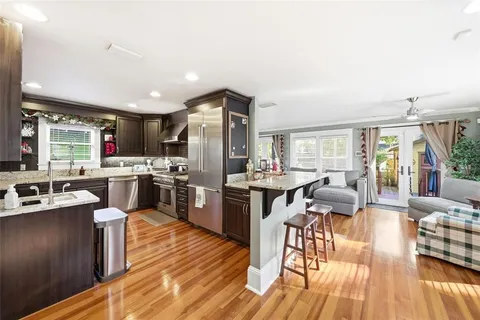a kitchen with lots of counter top space and stainless steel appliances