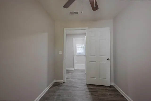 a backyard of a house with plants and outdoor seating