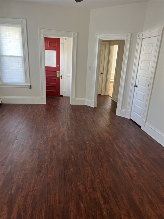 15 Maple Avenue, Unit 1 Bridgewater, MA 02324 - Photo 6 of 8 an empty room with wooden floor and windows