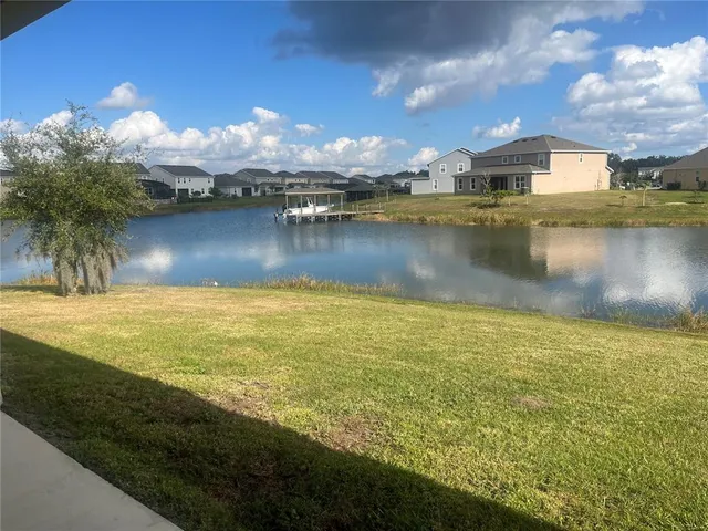 a view of a lake with a big yard