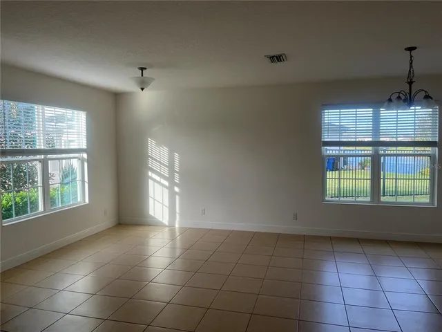 a view of an empty room and window
