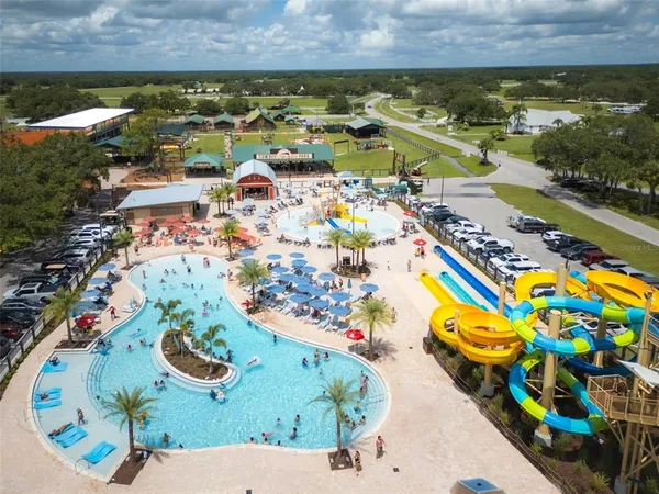 an aerial view of a resort with swimming pool