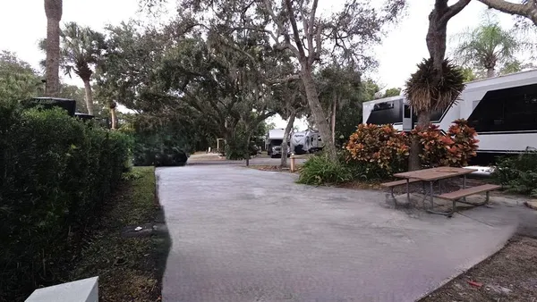 a view of a backyard with sitting area