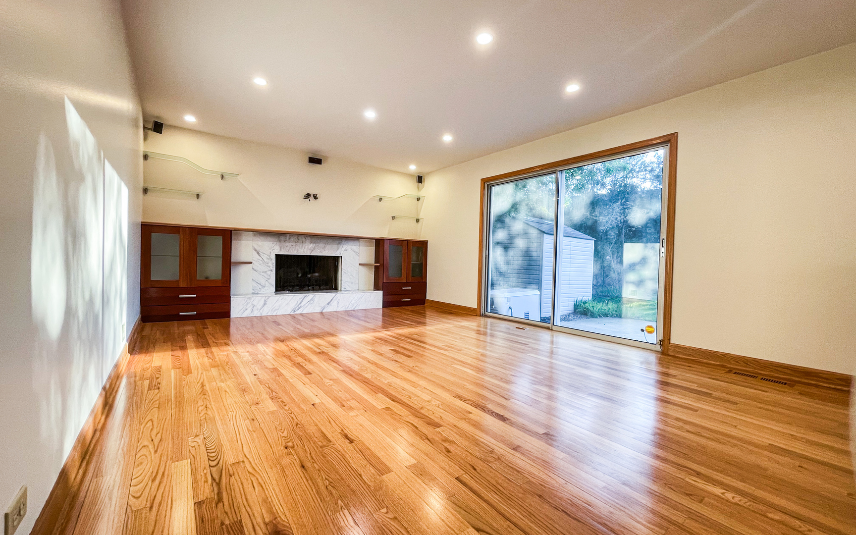 1640 Barry Lane Glenview, IL 60025 - Photo 11 of 42 a view of an empty room with wooden floor and a window