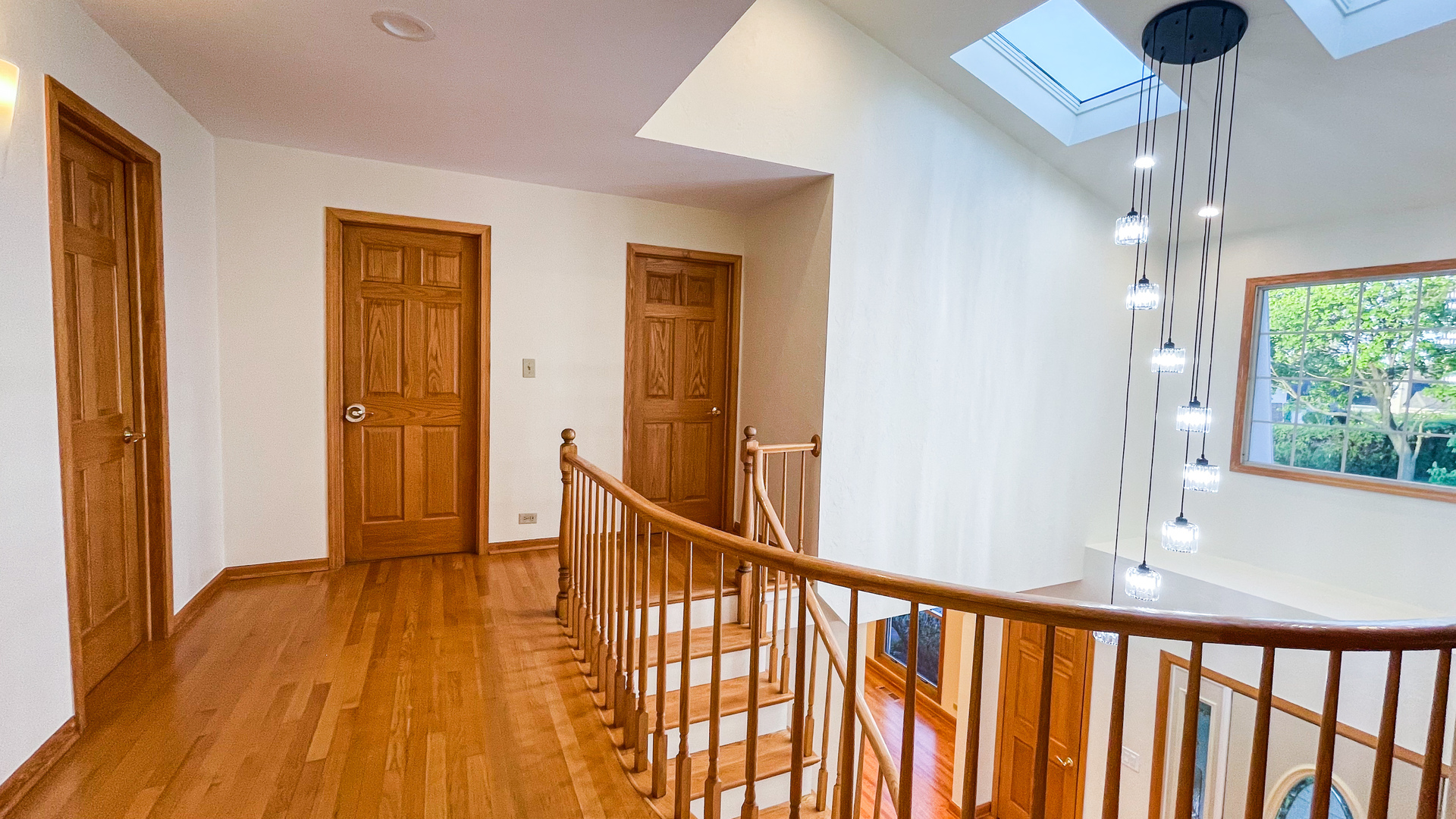1640 Barry Lane Glenview, IL 60025 - Photo 20 of 42 a view of a hallway with wooden floor and staircase