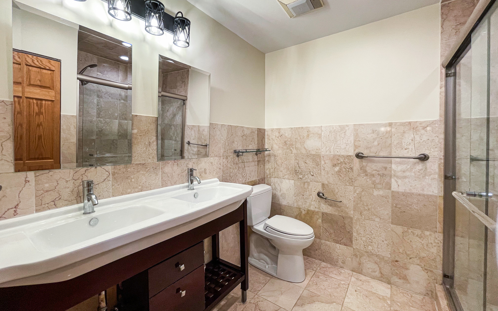 1640 Barry Lane Glenview, IL 60025 - Photo 22 of 42 a bathroom with a double vanity sink toilet and shower