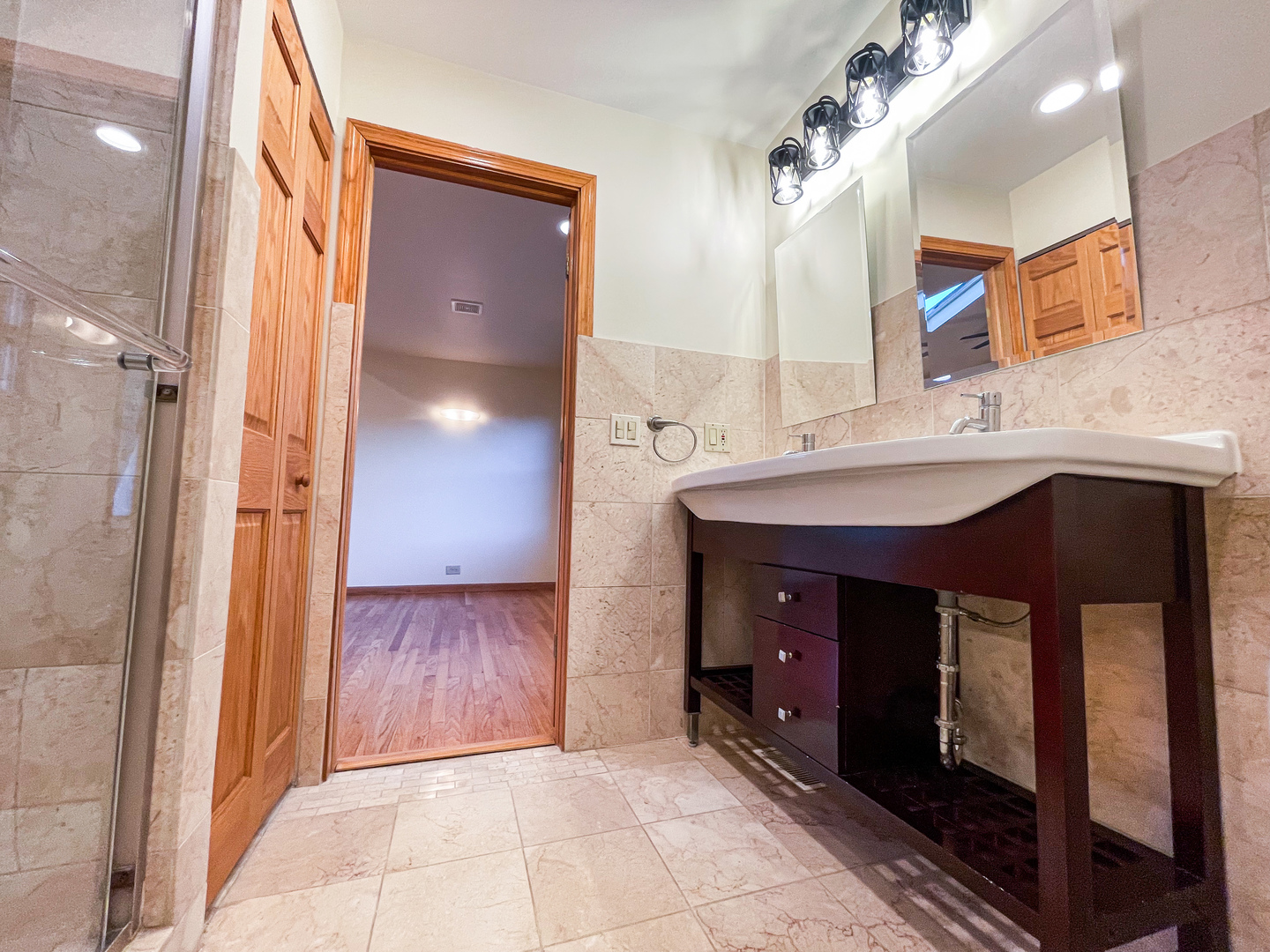 1640 Barry Lane Glenview, IL 60025 - Photo 23 of 42 a bathroom with a sink and a mirror
