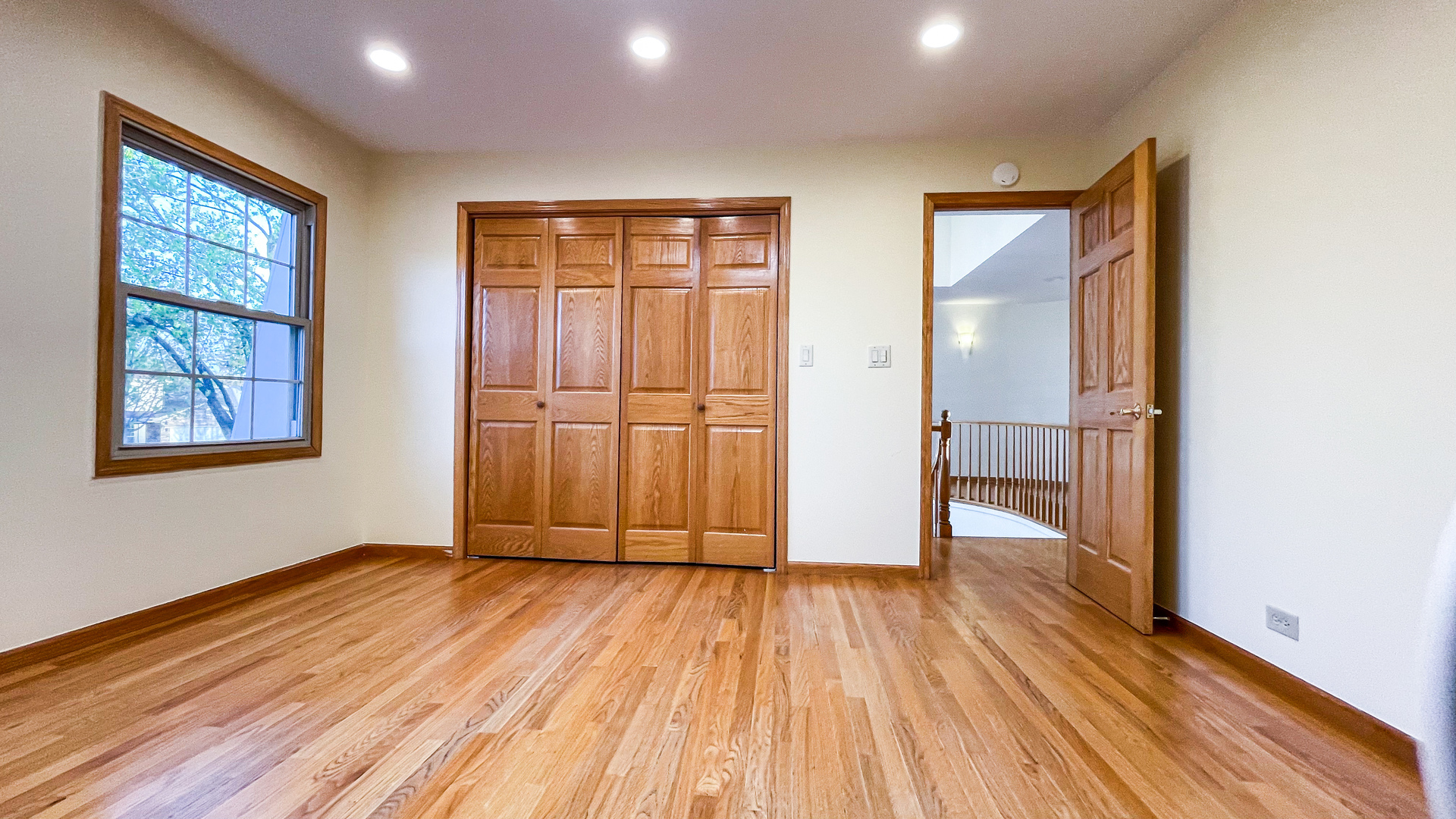 1640 Barry Lane Glenview, IL 60025 - Photo 26 of 42 an empty room with wooden floor and windows
